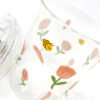 Taza de vidrio estampa y tapón de sorbete de flores